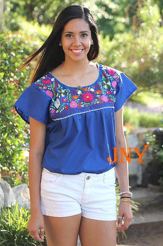 Royal Blue," "Hand-Embroidered," "Mexican Puebla Blouse," "Floral Pattern," and "Fiesta Top.